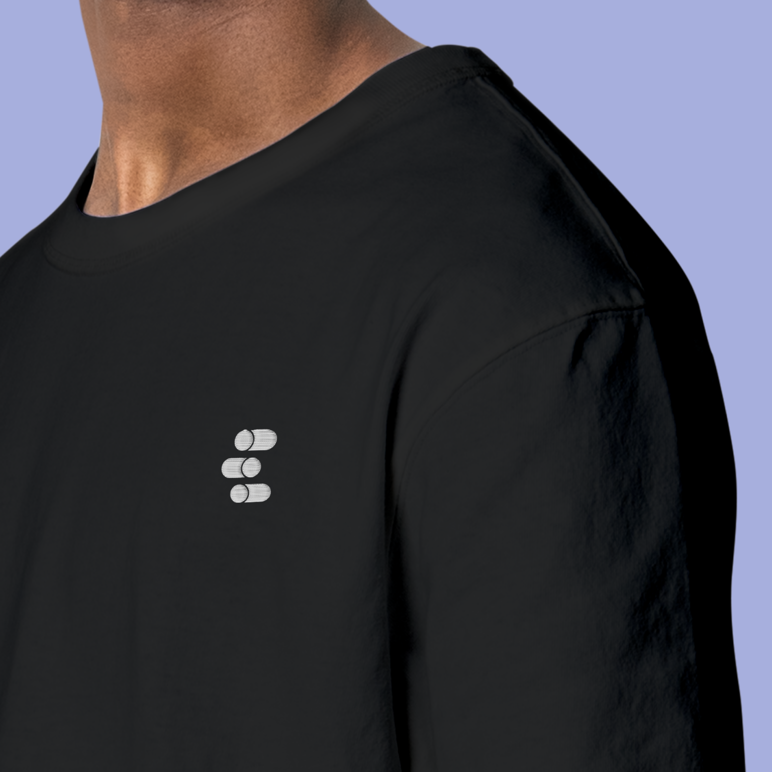 Front view person wearing  premium modern black t-shirt with eigenmode logo embrodery